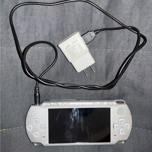 Sony Silver Handheld Console with Charger